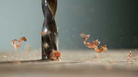 Super slow motion of detail of a drill bit drilling into wood. Filmed on high speed cinema camera, 1000 fps. - Powered by Shutterstock - Get 15% off with code: PIKWIZARD15
