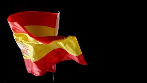 Super slow motion of waving flag of Spain isolated on black background. Filmed on high speed cinema camera, 1000fps.