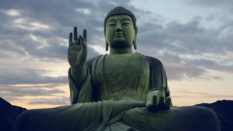 Buddha sculpture timelapse sky meditation