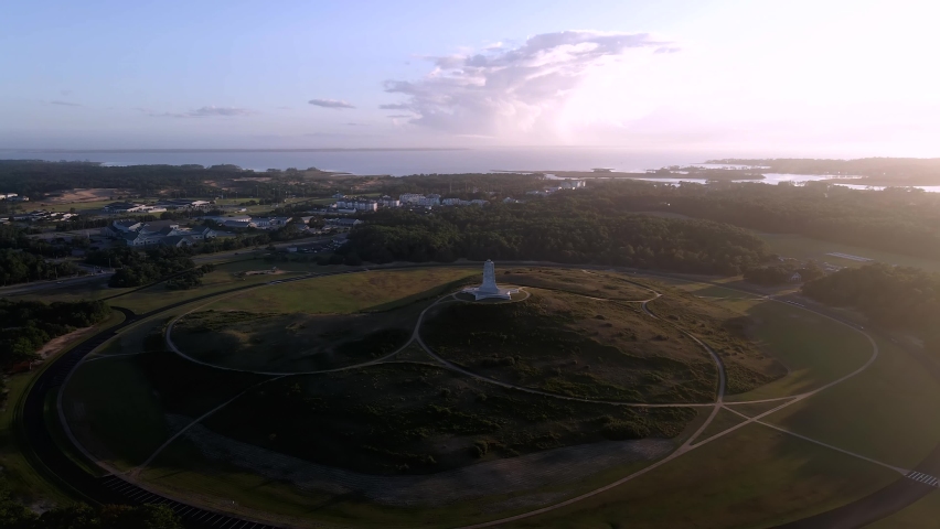 4k aerial drone flyover of Wright Brothers National Monument near Kitty Hawk, North Carolina during sunset at the Outer Banks