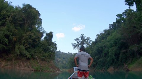 Khao Sok , Thailand - 11 21 2019: Traveling by boat through river in Khao Sok national park in Thailand