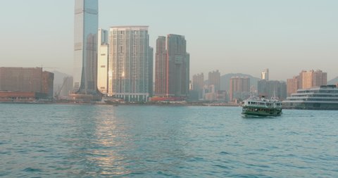 Navigating on Victoria Harbour (South China sea). 4k high dynamic range footage shot in Hong Kong. Beautiful sunny day on a boat.