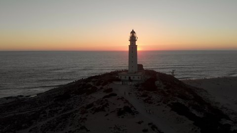 Aerial view of Cape Trafalgar lighthouse at sunset.