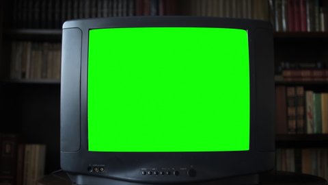 Vintage Analog Television with Green Screen in room