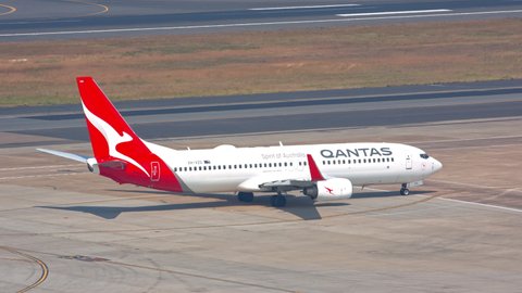 SYDNEY, AUSTRALIA - 2020: Qantas Boeing 737-800 Jet Airliner Arriving to Terminal Building Gate Exterior at Sydney SYD Kingsford Smith International Airport on a Sunny Day in New South Wales Australia