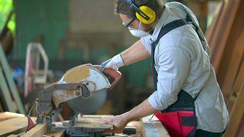 The carpenter working at workshop