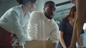 Diverse Team of Professional Businesspeople Meeting in the Office Conference Room. Creative Team Around Table, Black Male and Caucasian Female Speak for Marketing Compain, Social Media Strategy - Powered by Shutterstock - Get 15% off with code: PIKWIZARD15