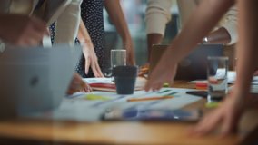 Diverse Multi-Ethnic Team of Professional Businesspeople Meeting in the Modern Office Conference Room. Creative Team Gathers Around Table to Discuss App Design, Analyze Data, Plan Strategy - Powered by Shutterstock - Get 15% off with code: PIKWIZARD15