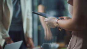 Diverse Multi-Ethnic Team of Professional Businesspeople Meeting in the Office Conference Room. Creative People Gather Around Table, Leader Shows Data Analysis on Digital Tablet Computer - Powered by Shutterstock - Get 15% off with code: PIKWIZARD15