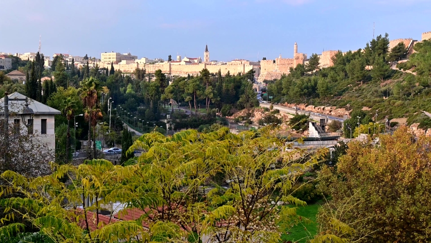 Franciscan Monastery of Saint Saviour, Jaffa Gate, Tower of David and the walls of Old City Jerusalem with beautiful trees; panoramic view over the Hinnom valley or Gehenna and Sultan