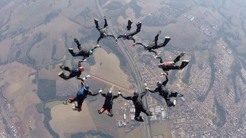 Skydiving people doing a formation in free fall