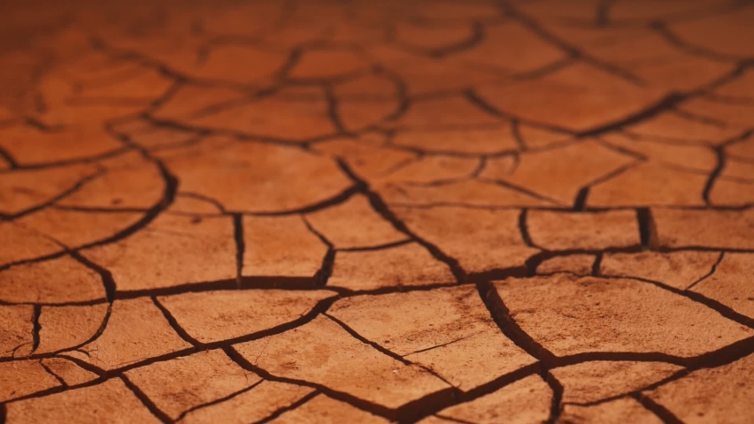 cracked soil in desert and water, dry and wet seasons. water scarcity affects every continent. lack of fresh drinking water, drought and global climate change. Royalty-Free Stock Footage #1063316320