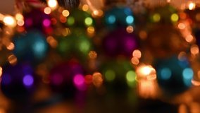 blurry lights of garlands. Bokeh on the Christmas tree. Vertical video. 