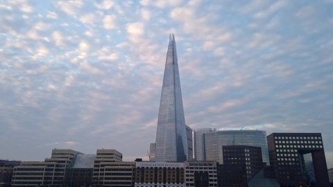 London, England - November 06 2020: Time lapse of the Shard building, 32 London Bridge St, London, with altocumulus clouds in the background