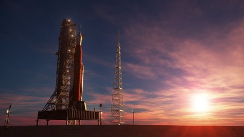 Big heavy rocket (Space Launch System) on launchpad on the background of sunrise. 3D animation. 4K. Ultra high definition. 3840x2160.