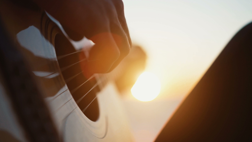 Close up shot of playing guitar