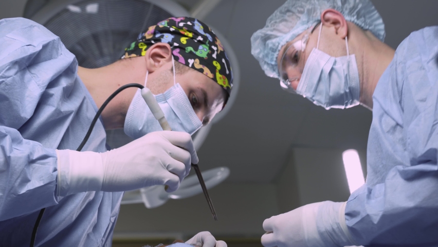 Surgeons do plastic operation in medical clinic. Surgery. Professional medecine. Skin care. Correcting form of face for patient