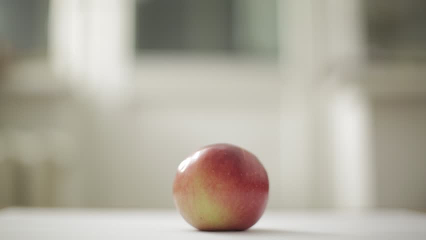 small girl eating an apple.