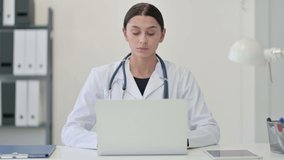 Female Doctor Talking on Video Chat on Laptop 