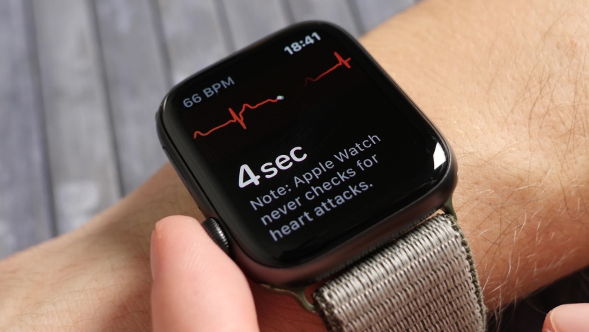 Bilten , Switzerland - 01 28 2020: Man doing an Electrocardiography on his smart watch