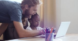 Multi ethnic family caucasian bearded young adult man father helping daughter afro american schoolgirl child with homework at laptop, homeschooling remote studying concept e-learning during quarantine