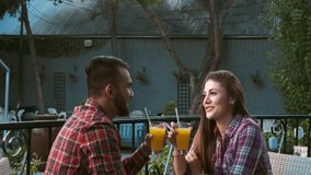 4k wide video of young multiracial happy and romantic couple chatting on date in cafe. 