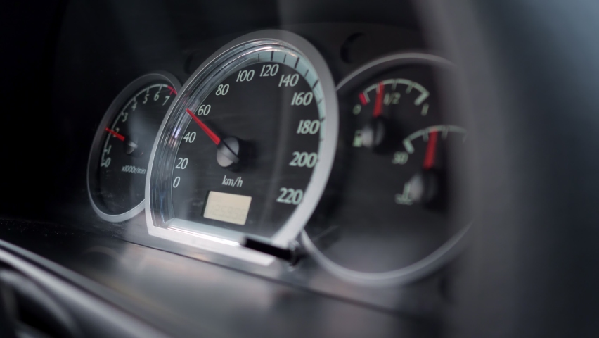 close-up of a car dashboard with a speedometer showing a speed of 60 km per hour. Royalty-Free Stock Footage #1063349095