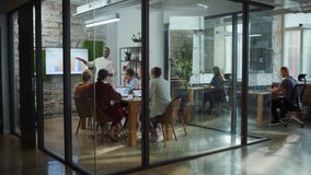 Office Conference Room Meeting: Male Chief Executive Talking to a Diverse Team of Professional Businesspeople. Creative People Listen to CEO Discuss Design, Data Analysis, Plan Marketing Strategy - Powered by Shutterstock - Get 15% off with code: PIKWIZARD15