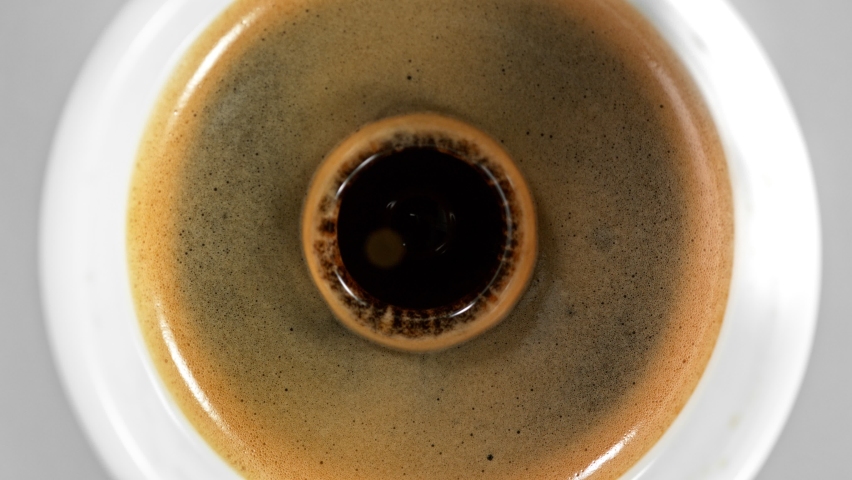 Super Slow Motion Detail Shot of Coffe Drop Falling into Fresh Espresso at 1000 fps. | Shutterstock HD Video #1063351600