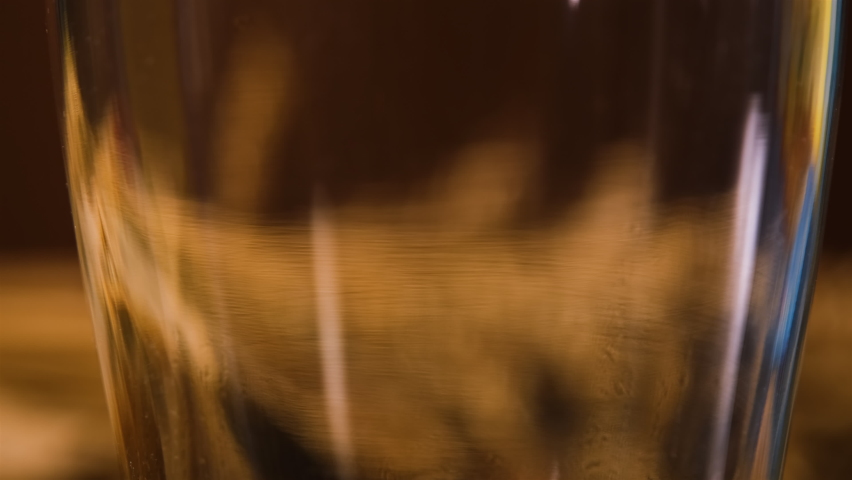 Close up of Unfiltered Beer or Ale Being Poured into a Glass. Food and Drinks, Leisure Lifestyle and Holidays Concept Royalty-Free Stock Footage #1063357831