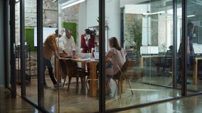 In the Stylish Modern Office Meeting Room: Diverse Multi Ethnic Group of Business Growth Marketing Professionals Use Computers, Discuss Project Ideas, Brainstorm Strategy, Design Creative Product - Powered by Shutterstock - Get 15% off with code: PIKWIZARD15