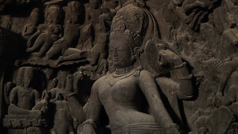 Ancient sculptures at Elephanta Caves, a collection of cave temples predominantly dedicated to the Hindu god Shiva on Elephanta Island in Mumbai, Maharashtra, India.