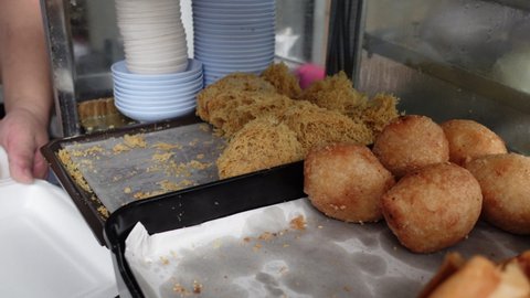 fried dim sum with different stuffing selling at Chinese restaurant