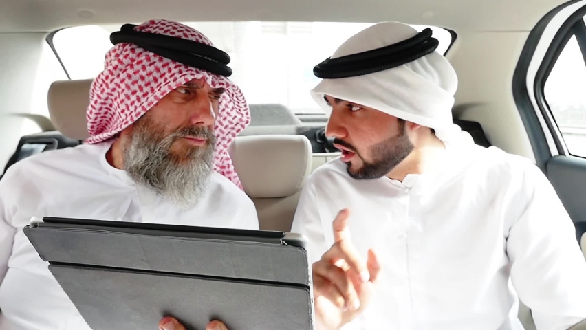
Young business man and his mentor spending time outdoor in Dubai