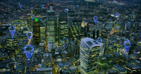 
Aerial smart city. Localization icons in a connected futuristic city.  Technology concept, data communication, artificial intelligence, internet of things. London skyline.