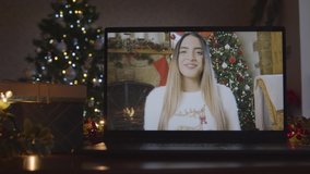 Close Up Shot of Young Woman During Video Call On Laptop Screen In Christmas Environment