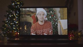 Close Up Shot of Young Man During Video Call On Laptop Screen In Christmas Environment