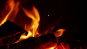 Detail of burning flames in fireplace in Slow Motion HD VIDEO. Natural fire filling full frame of screen. Quarter speed. Close-up.