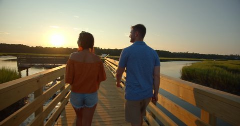 Couple Walking in Huntington Beach State Park at Sunset