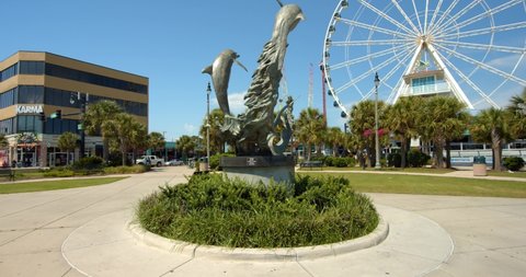 Myrtle Beach, South Carolina, United States - August 17, 2020: Dolphin Statue, Sculpture at Myrtle Beach, South Carolina