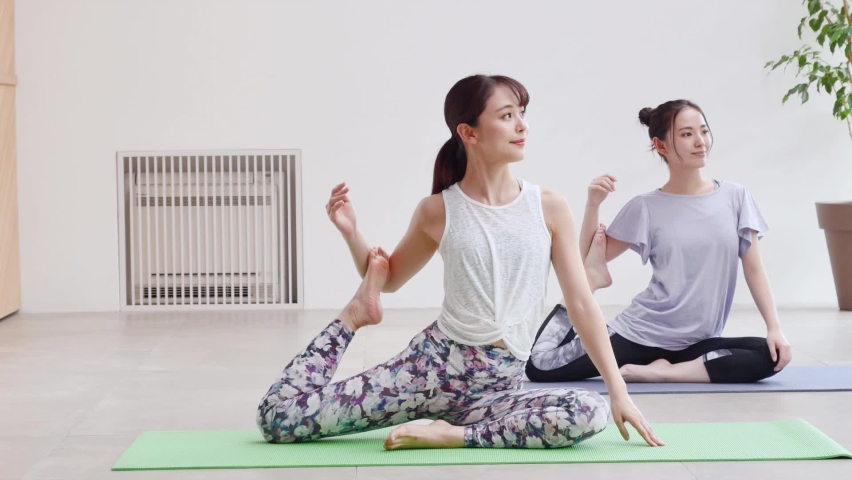 Asian women doing  yoga indoor Royalty-Free Stock Footage #1063392847