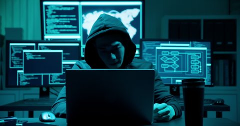 Asian male hacker is serious and angry