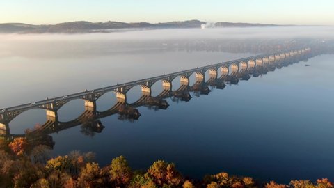 Aerial of Susquehanna River bridge between Lancaster County and York, PA, USA during morning fog and light.