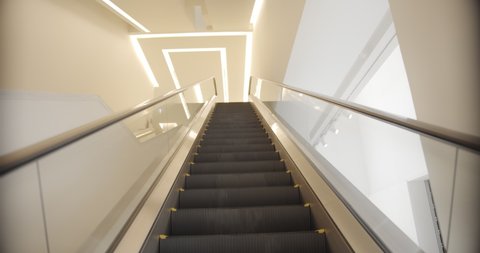 Modern Empty Working Escalator Going Up with modern light