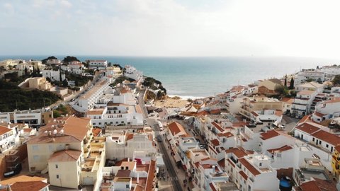Picturesque houses of Carvoeiro resort town and beach, Algarve. Aerial view 