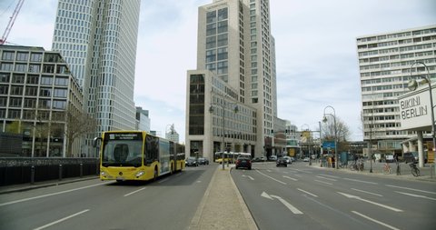 Berlin , Berlin , Germany - 04 16 2020: Urban City Center of Berlin with Typical Bus and Pan to Skyscrapers