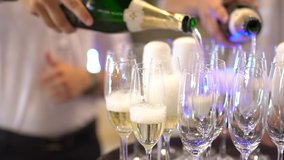 waiters pour champagne into glasses at party - Powered by Shutterstock - Get 15% off with code: PIKWIZARD15