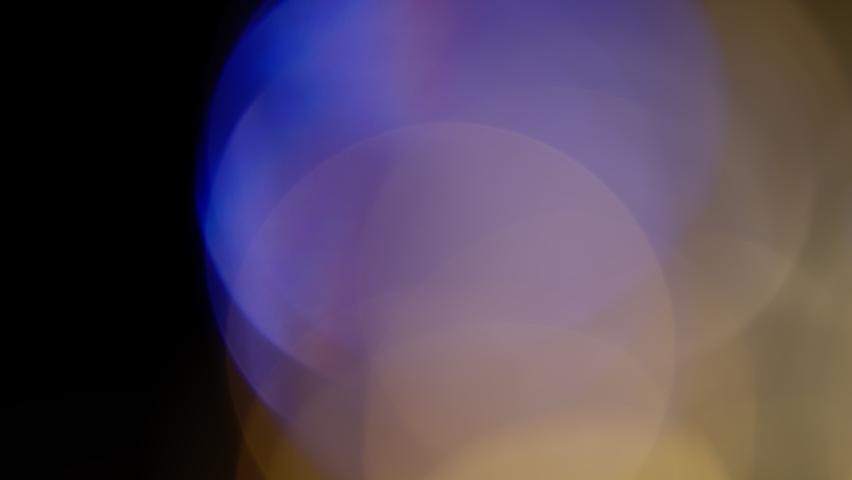 Multicolored light leaks 4k footage on black background. Lens studio flare leak burst overlays. Natural lighting lamp rays bokeh effect. For compositing over your footage, stylizing video, transitions | Shutterstock HD Video #1063418650