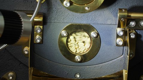Raw Coffee Beans In A Modern Machine

