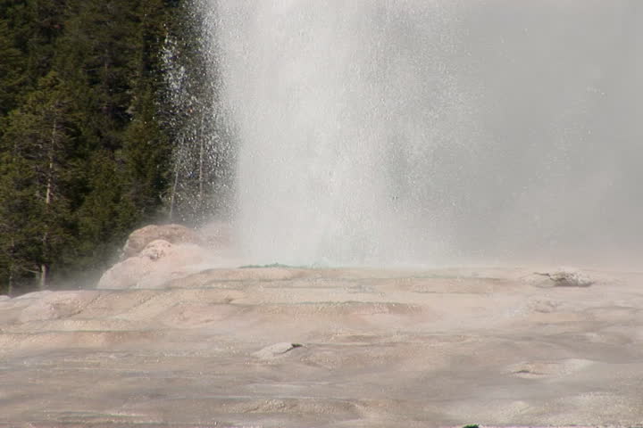 NTSC: Old Faithful erupts - tilt up close. Shot in Yellowstone National Park